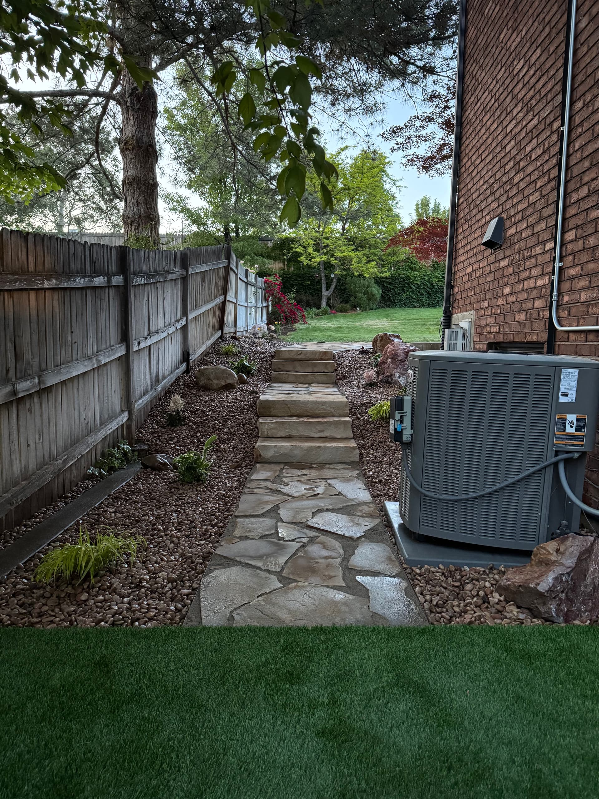 Flagstone Patio and Turf Play Area Built for Real Family Life